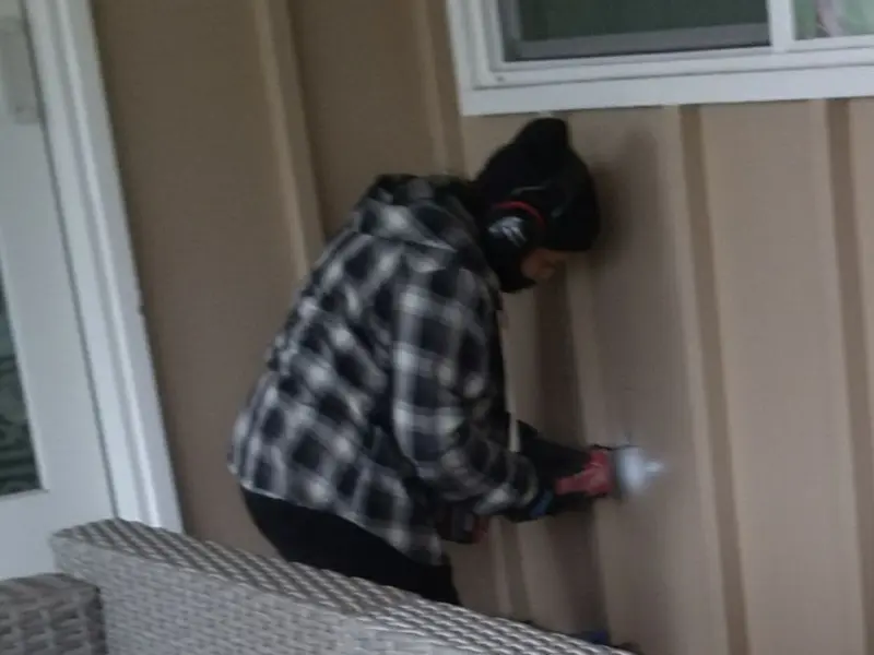 Professional electrician installing an exterior outlet in Island Lake